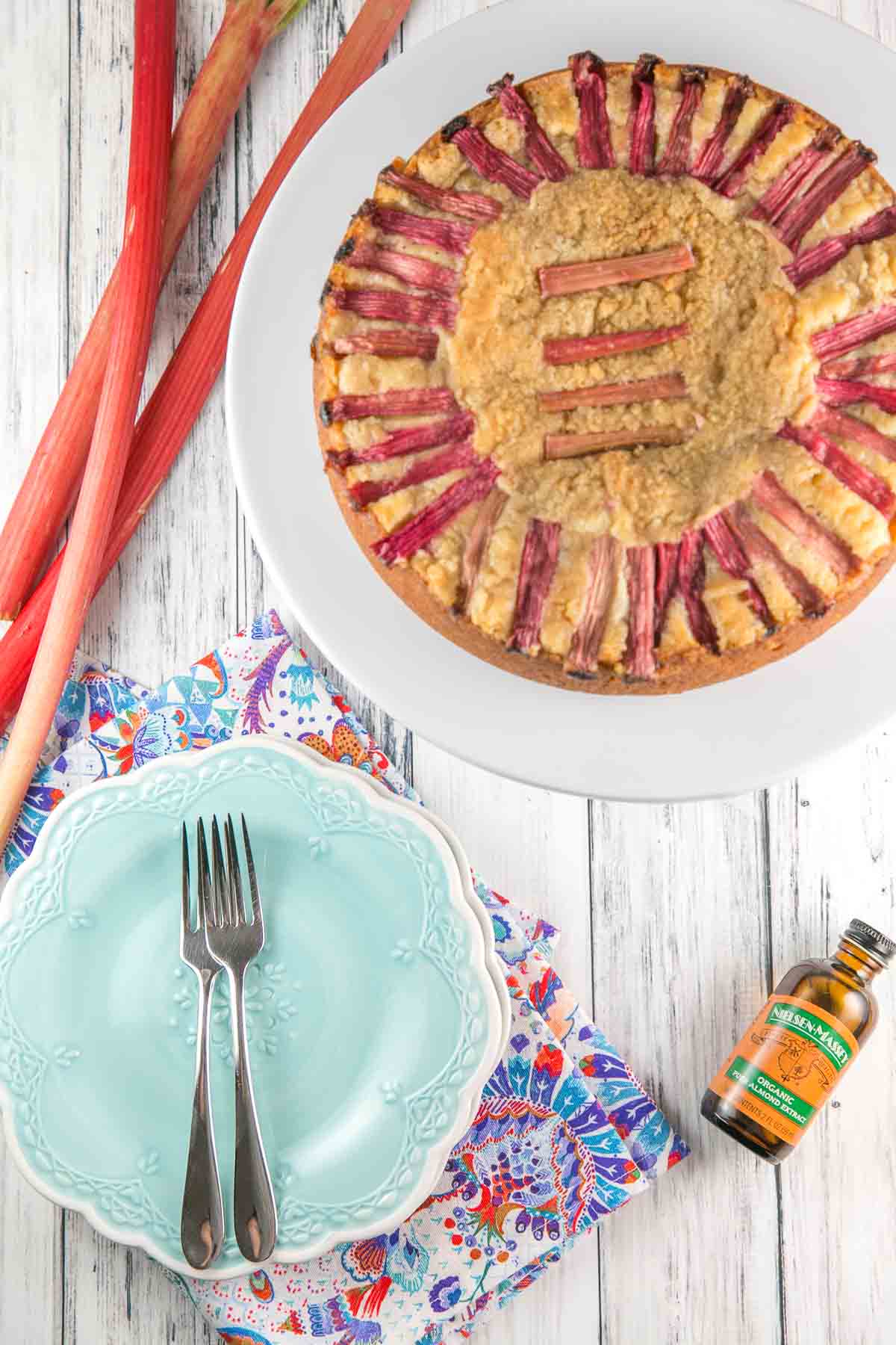 Almond Rhubarb Cake: a light and fluffy almond cake filled with sliced rhubarb. Top with ice cream and rhubarb syrup for an extra treat! {Bunsen Burner Bakery} [ad] #rhubarb #almond #cake #coffeecake