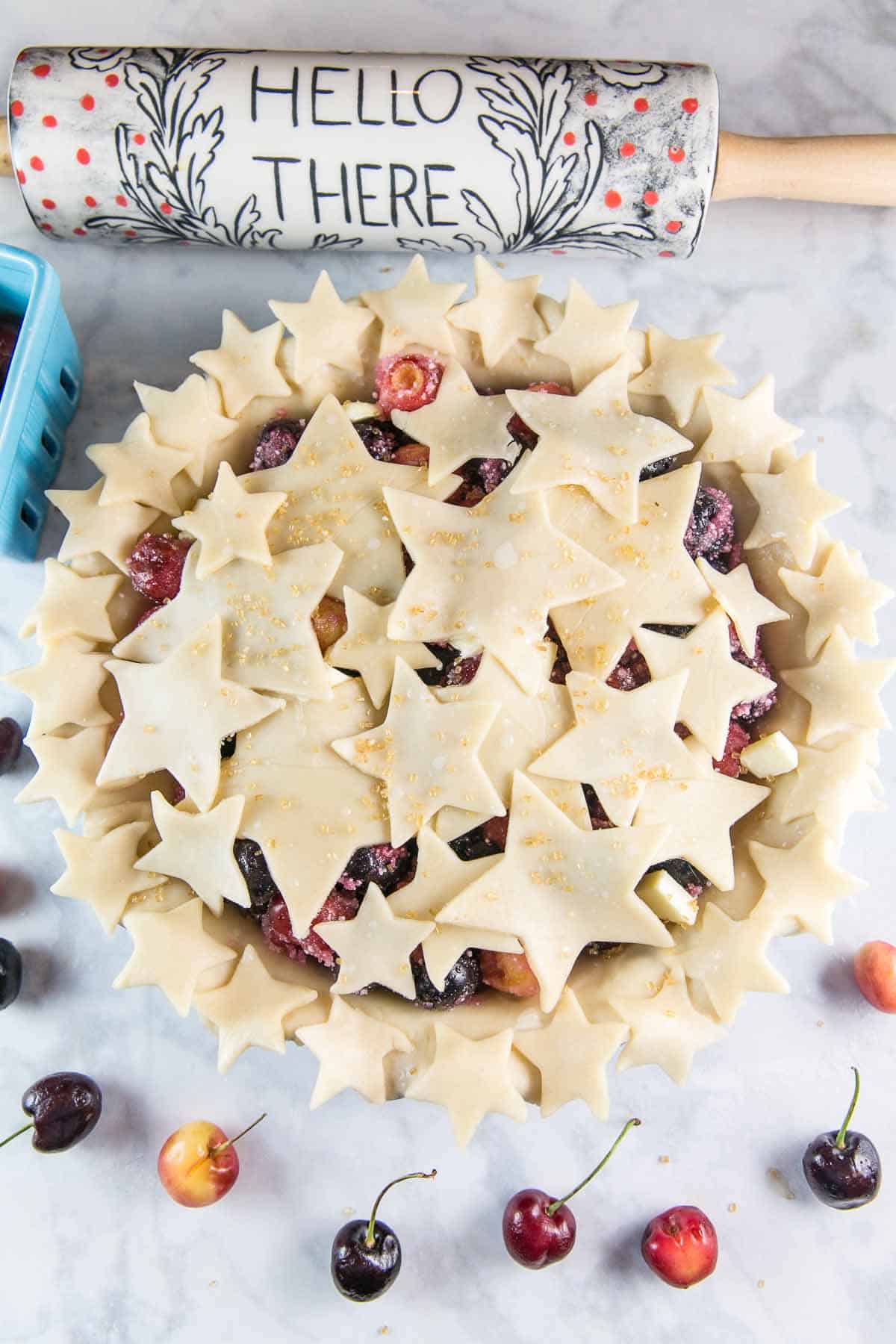 unbaked pie covered with star shapes cut out of the pie crust