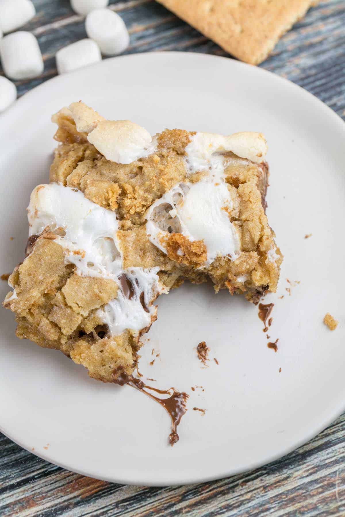 s'mores bar on a plate with one bite taken out of it