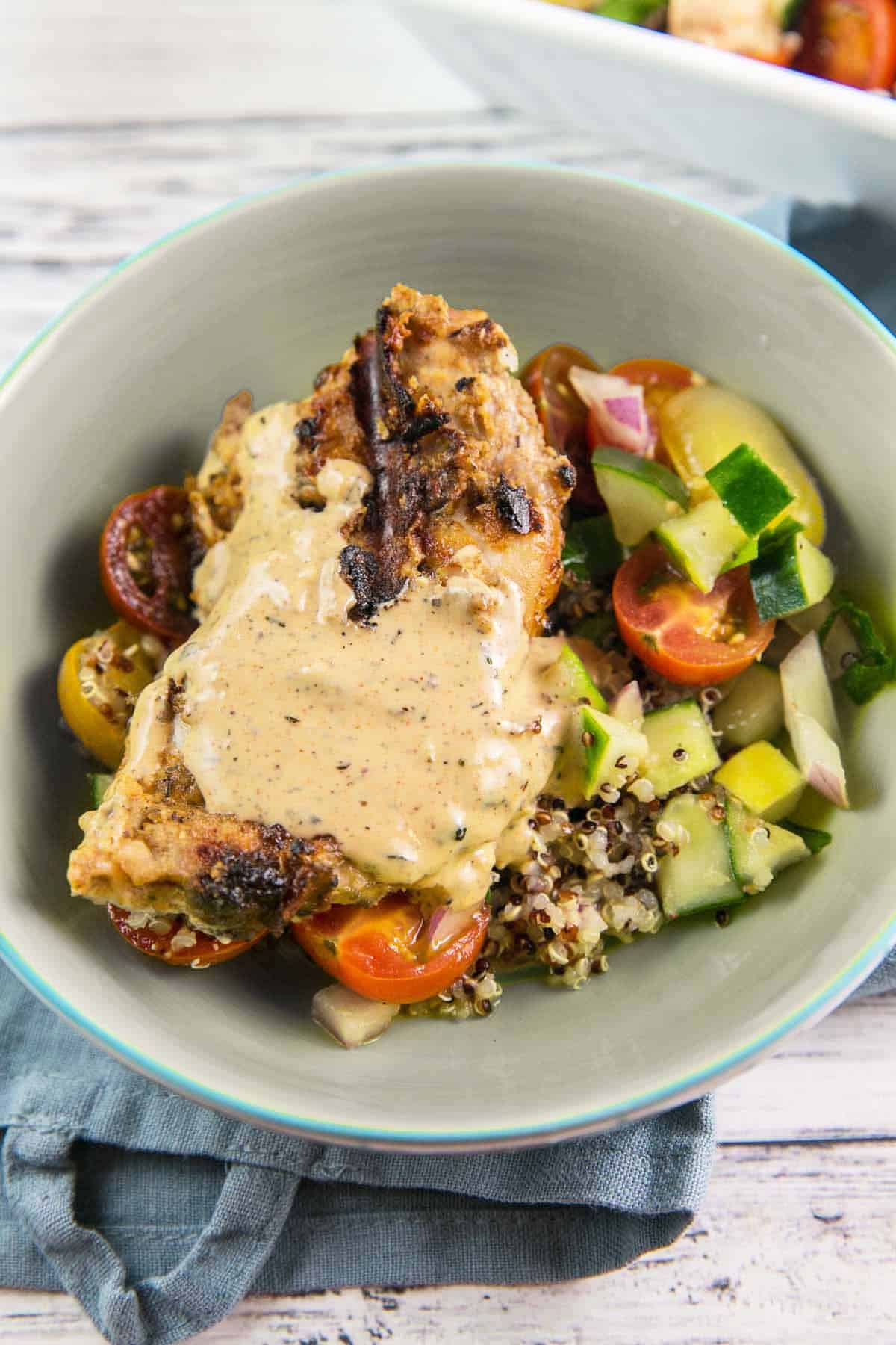 bowl of easy grilled chicken with quinoa and salad