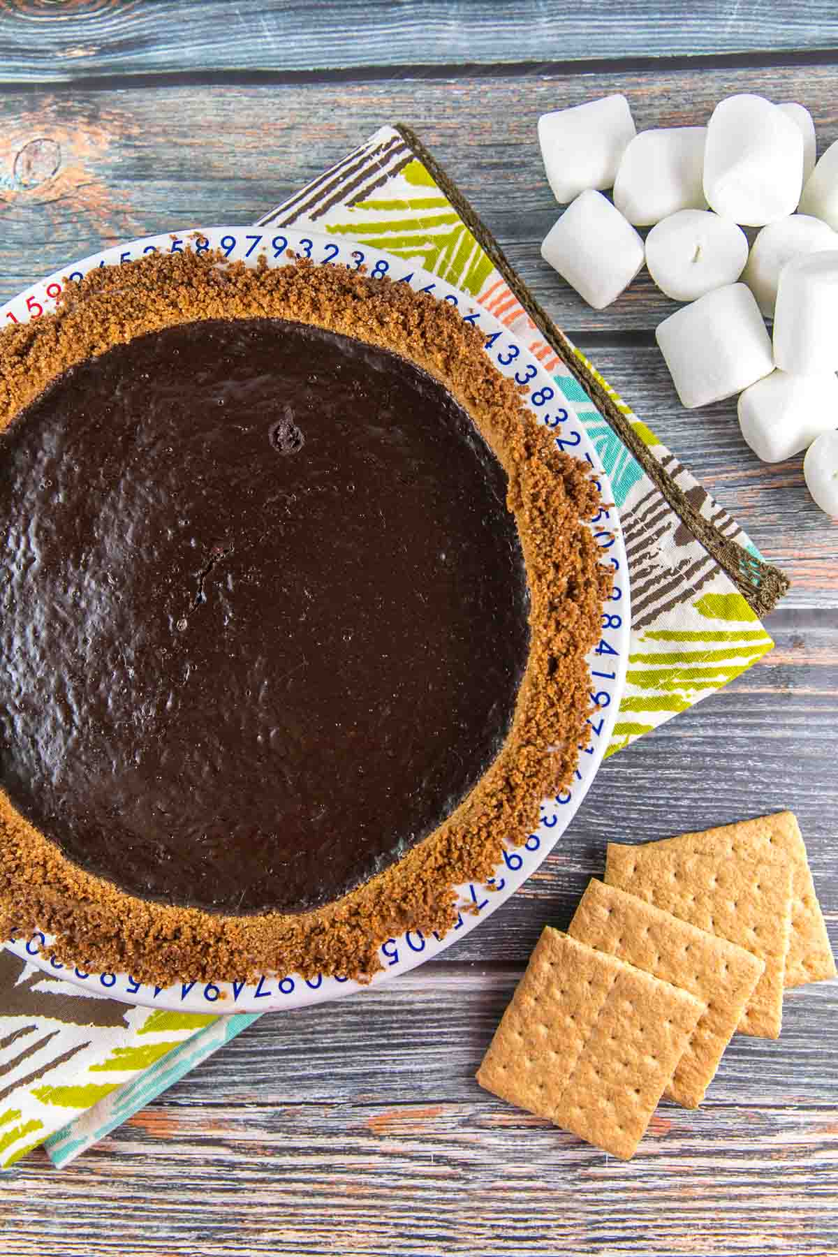 creamy chocolate pie in a graham cracker crust