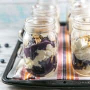 no bake cheesecake parfaits layered with homemade blueberry curd