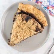 a slice of shoofly pie with a buttery crumb topping