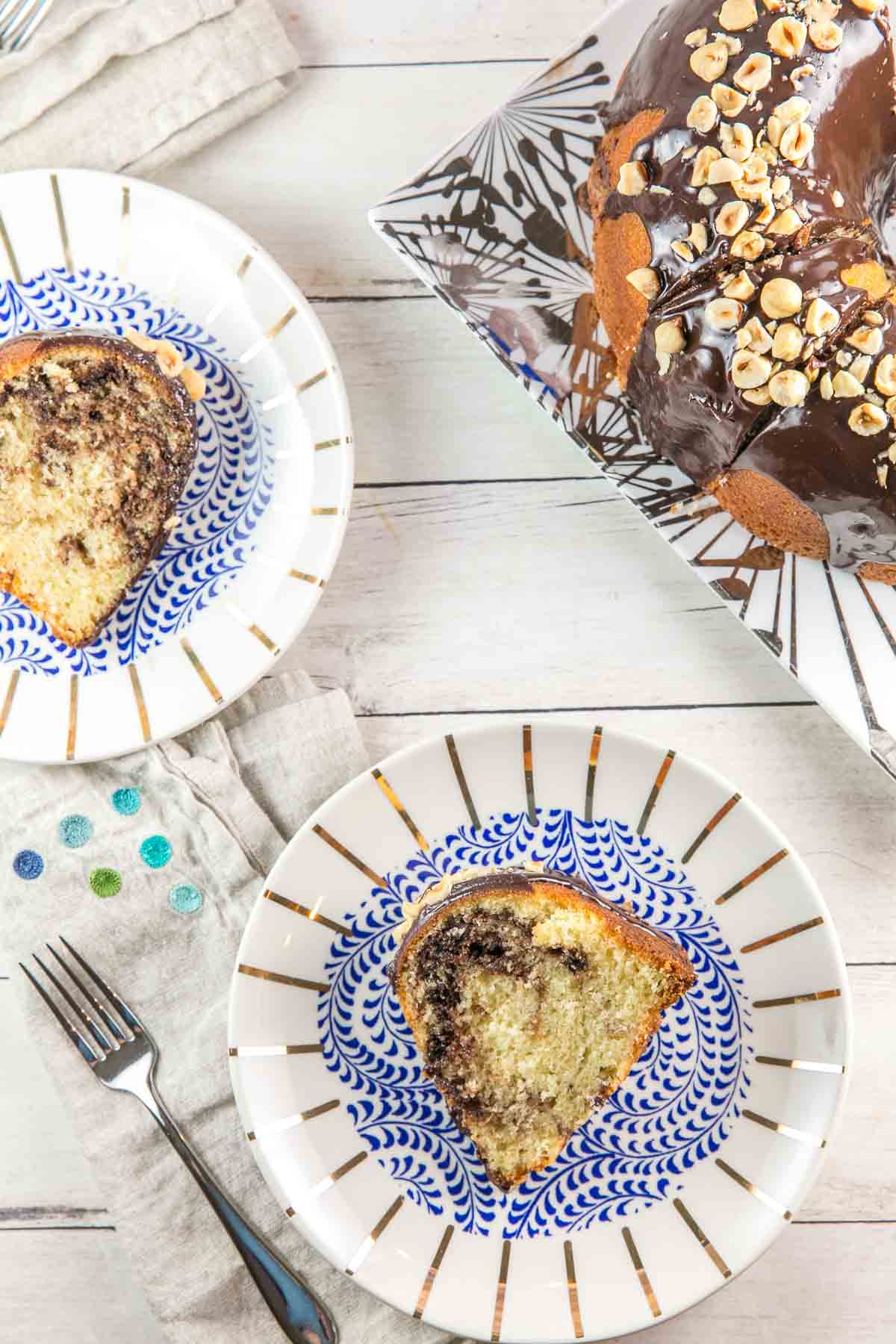 two slices of nutella bundt cake on blue and white plates