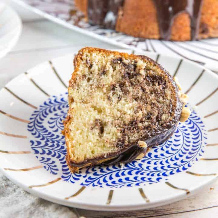 slice of bundt cake swirled with nutella on a decorative dessert plate