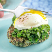 quinoa cake with a poached egg with runny yolk on top