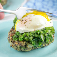 quinoa cake with a poached egg with runny yolk on top