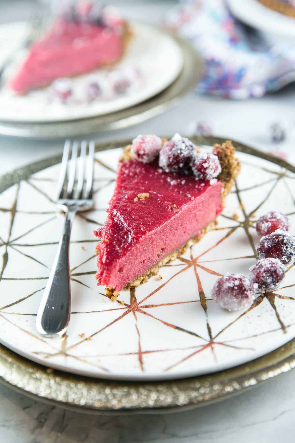 angled view of cranberry curd pie showing the smooth curd texture.