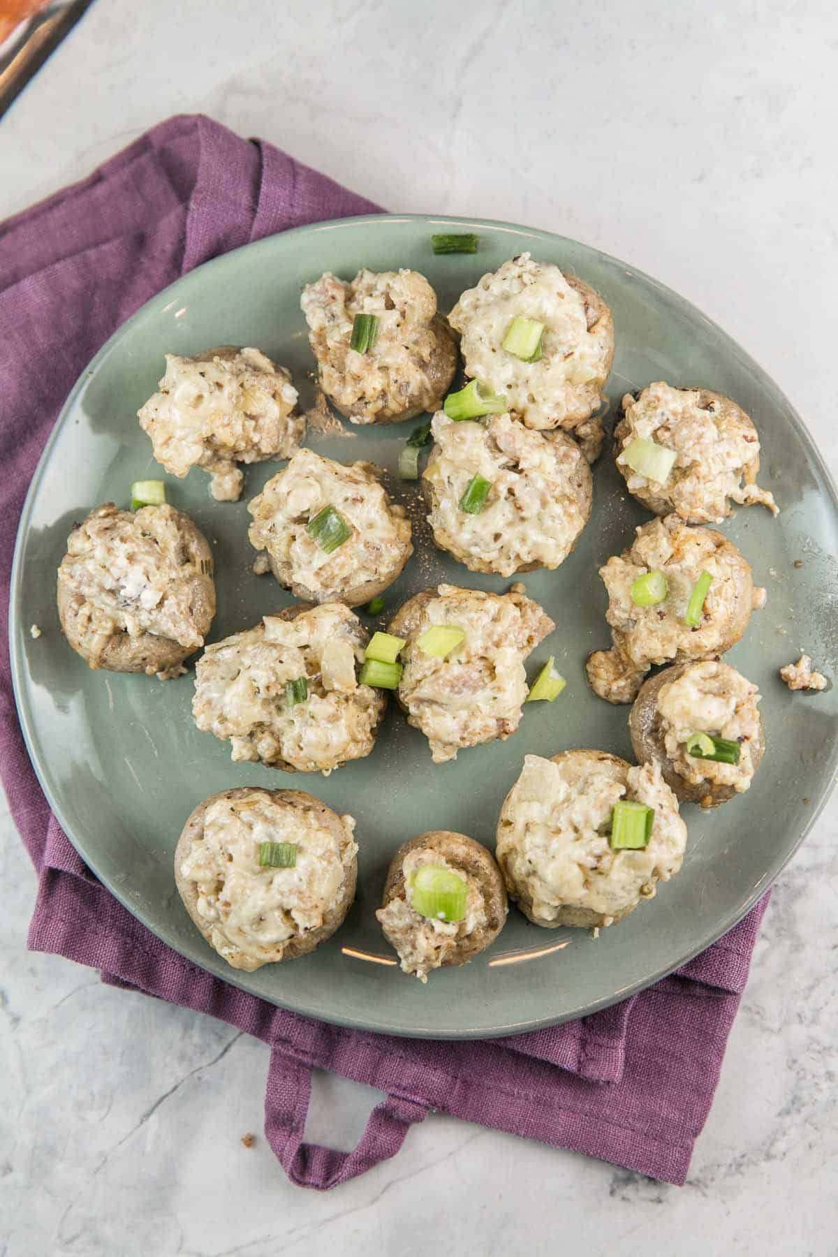 Instant Pot Stuffed Mushrooms: a classic sausage stuffed mushroom recipe, updated for your pressure cooker. Leave the oven free for dessert and make stuffed mushrooms right in the Instant Pot with fewer dishes, less time, and more flavor. #bunsenburmerbakery #partyfood #superbowlparty #appetizers #ad