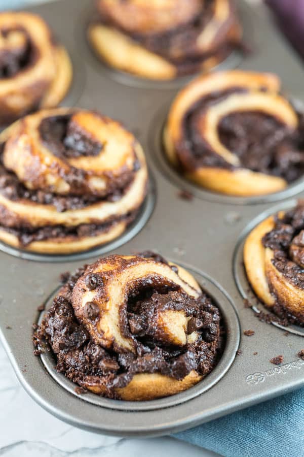chocolate swirled babka muffins in a muffin tin