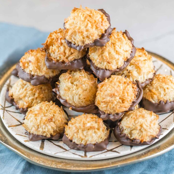 pile of toasted golden brown macaroons on a decorative plate