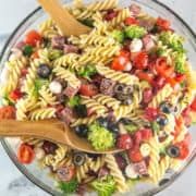 Classic Italian Pasta Salad: full of fresh vegetables, cheese, and salami, this colorful pasta salad is the perfect summer side. An extremely easy crowd pleaser that is even better when made ahead of time! #bunsenburnerbakery #pastasalad #summerside #pasta #picnic