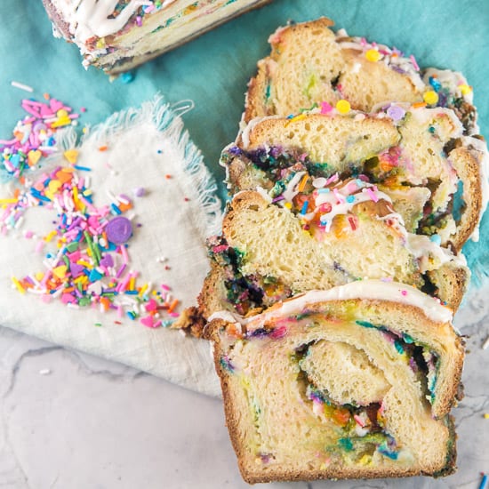 Funfetti Babka: This birthday cake flavored, sprinkle filled, glazed yeast bread babka is the ultimate festive sweet treat!  Sprinkles for breakfast?  Absolutely! #bunsenburnerbakery #babka #sprinkles #funfetti #yeastbread