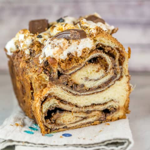 S'mores Babka: Think chocolate babka is the best babka? Think again -- with this s'mores babka! Add graham crackers and gooey toasted marshmallows for an extra special treat! #bunsenburnerbakery #smores #babka #yeastbread #smoresdesserts