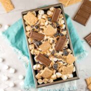 chocolate graham cracker bread in a loaf pan covered with toasted mini marshmallows