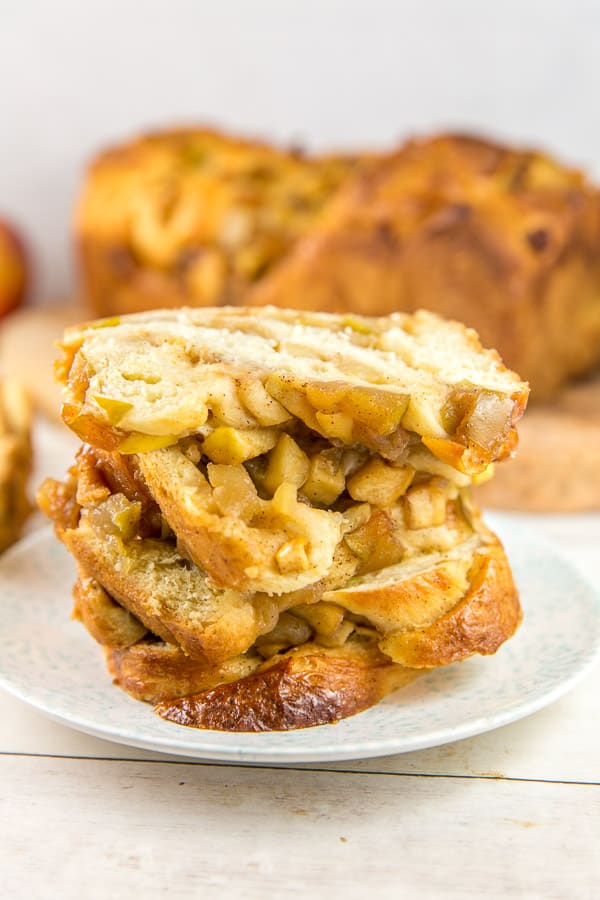 slices of honey apple babka stacked on a dessert plate