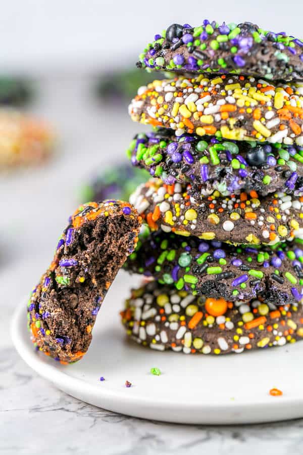 cookies with a bite taken out of it showing the thick, fudgy, chocolatey interior.