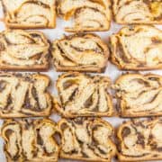 Pumpkin Chocolate Chip Babka: Filled with pumpkin puree, pumpkin pie spices, and chocolate chips and covered with a chocolate chip streusel, this pumpkin chocolate chip babka is a fall take on everyone's favorite chocolate babka. #bunsenburnerbakery #bread #yeastbread #babka #chocolatebabka #pumpkinbread #pumpkinchocolatechip