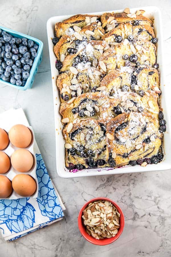 overnight baked babka french toast casserole in a white serving dish.