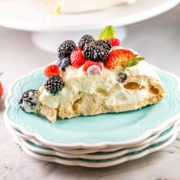 Berry Pavlova with Lemon Curd Cream: This classic pavlova recipe is the perfect entertaining dessert. Fancy enough for a dinner party, but extremely easy to make and everything can be made ahead of time! #bunsenburnerbakery #pavlova #berries #lemon #lemoncurd