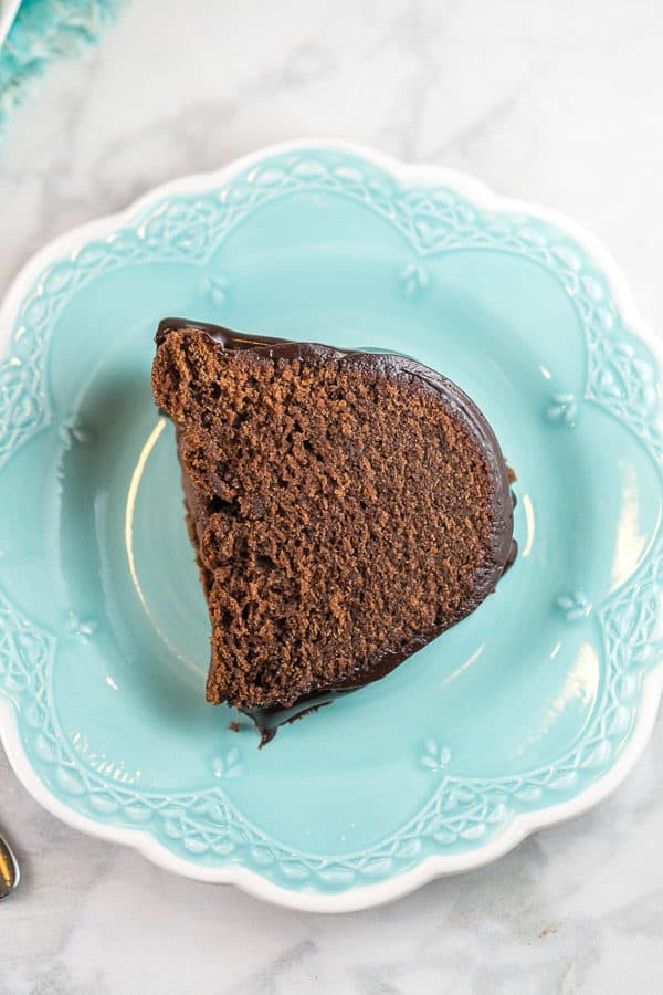 a slice of cake on a dessert plate highlighting the fine crumb of the cake
