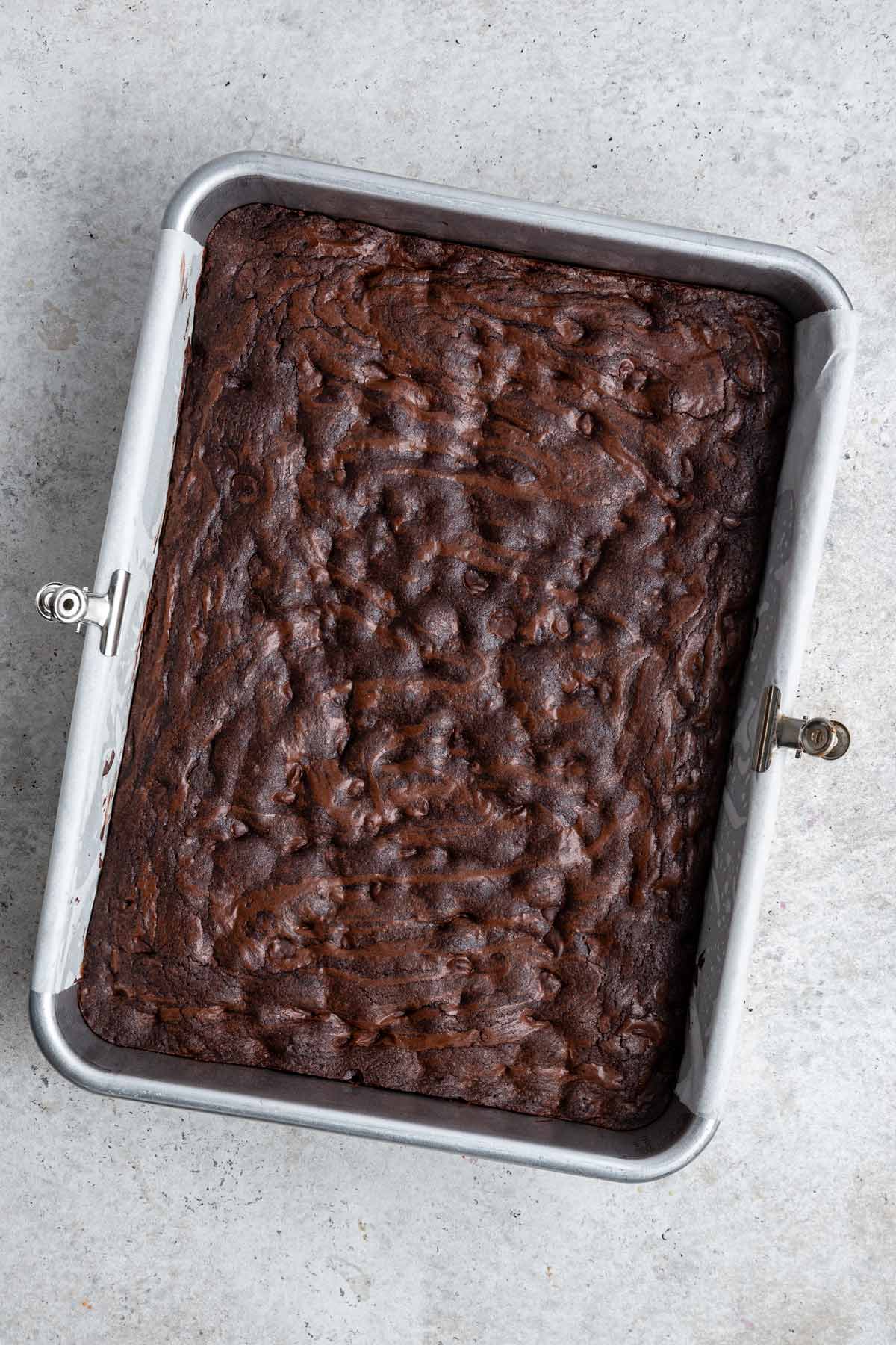 freshly baked pan of brownies with shiny crackly tops