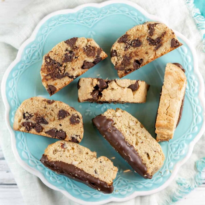 almond and chocolate chip mandelbrot on a decorative blue plate