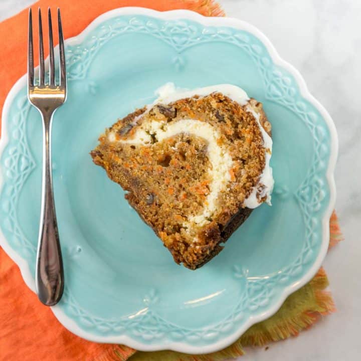 carrot bundt cake filled with a swirl of cream cheese frosting