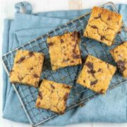 freshly baked tahini blondies with chocolate chips on a cooling rack