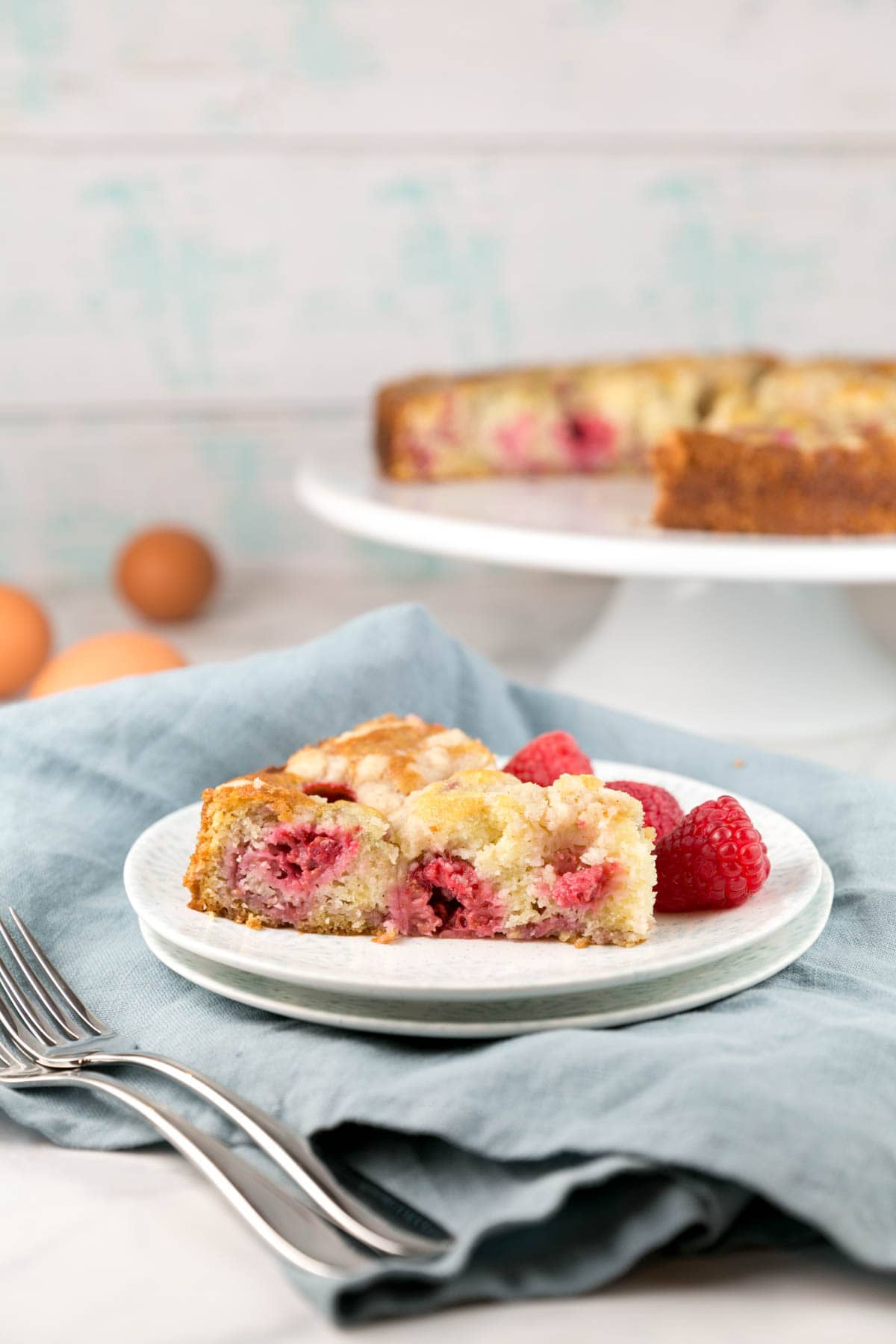 slice of raspberry breakfast cake on a dessert plate