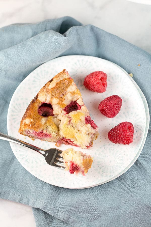 a slice of raspberry crumb cake on a plate