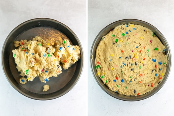 cookie dough piled in a springform pan and spread out in an even layer