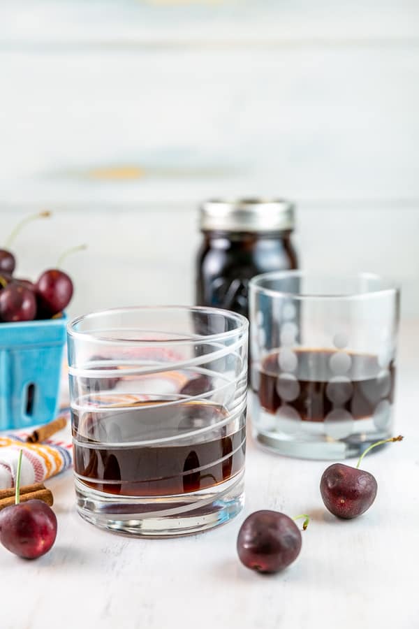 two lowball glasses filled with cherry bounce liquor