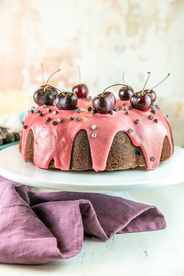 pound cake with cherry glaze on a cake stand