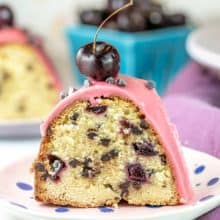 Chocolate Chip Cherry Pound Cake: an easy, moist vanilla almond pound cake filled with chopped cherries (fresh, frozen, or maraschino) and chocolate chips, topped with a cherry fudge frosting. Make in a bundt pan or loaf pan. #bunsenburnerbakery #poundcake #bundtcake #cherries #chocolatecherry