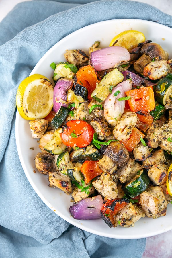 mediterranean chicken and vegetables pulled off the skewer and piled in a serving bowl