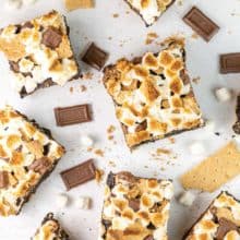smores brownies surrounded by chocolate and graham crackers