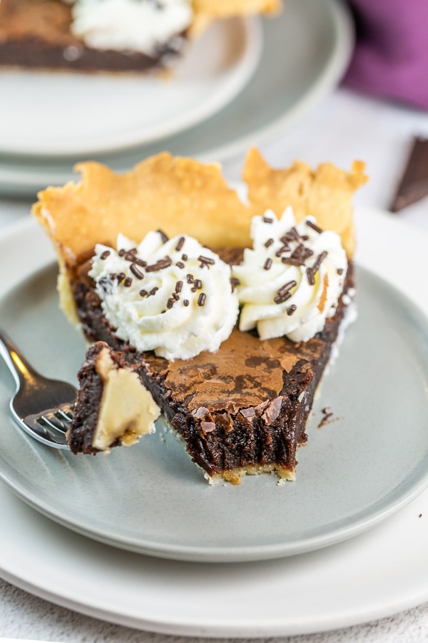 a fork removing one biteful of brownie pie