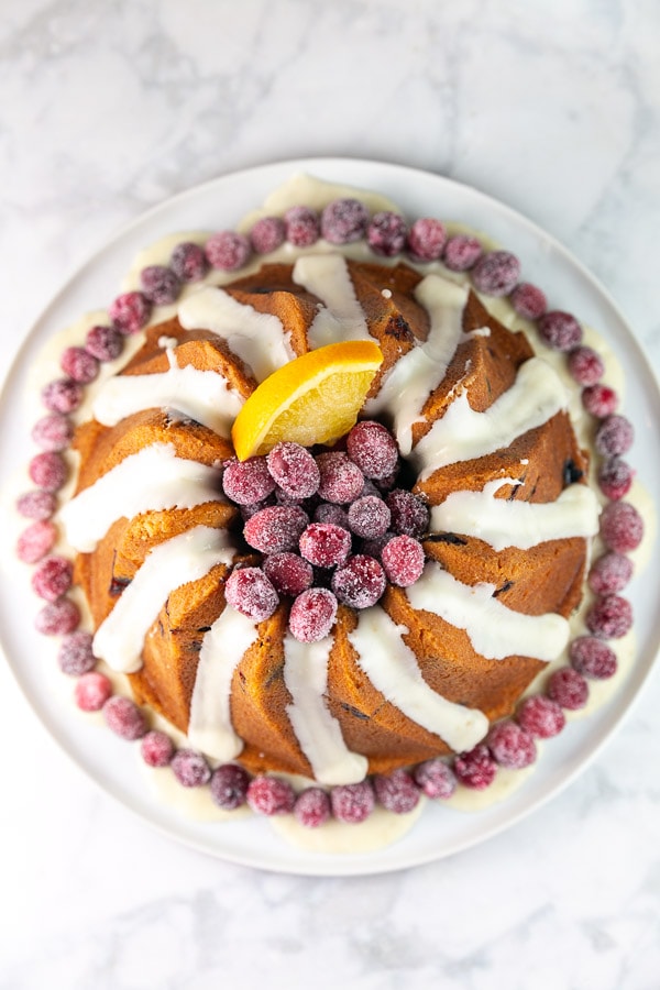 overhead view of the bundt cake with the center filled with sugared cranberries.