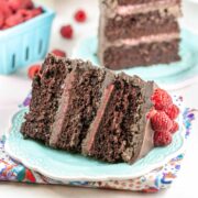 slice of three layer chocolate cake filled with raspberry curd