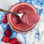 homemade raspberry curd in a mason jar