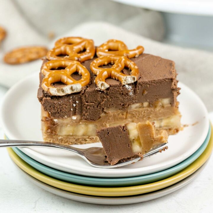 slice of chocolate peanut butter pretzel pie with one forkful removed