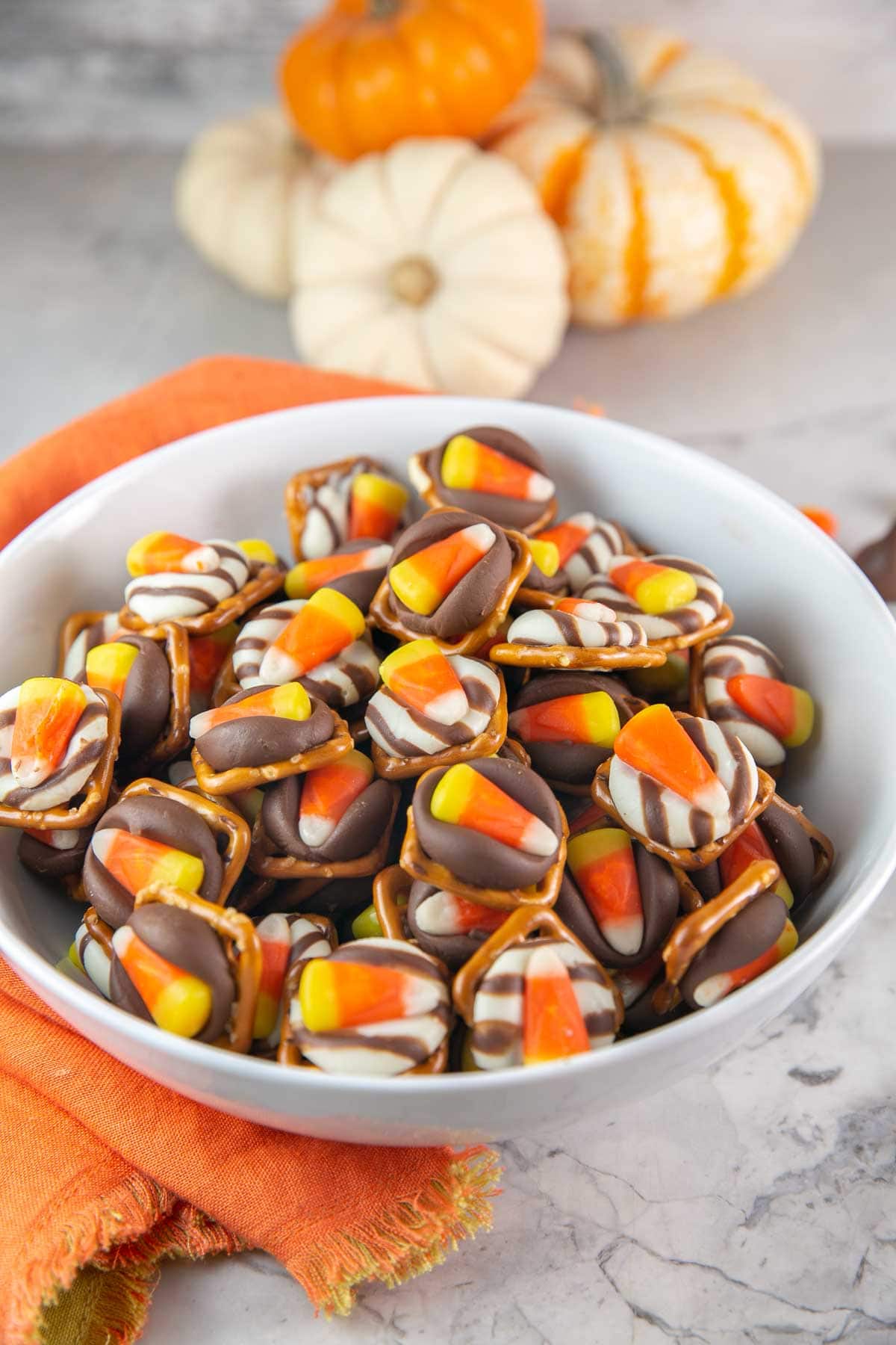 Halloween candy corn kiss pretzel bites in a white bowl