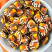Candy Corn Pretzel Bites: A pretzel, a kiss, and a piece of candy corn make the perfect easy Halloween treat! Make ahead and perfect for class parties, "boo bags", or adult Halloween parties!