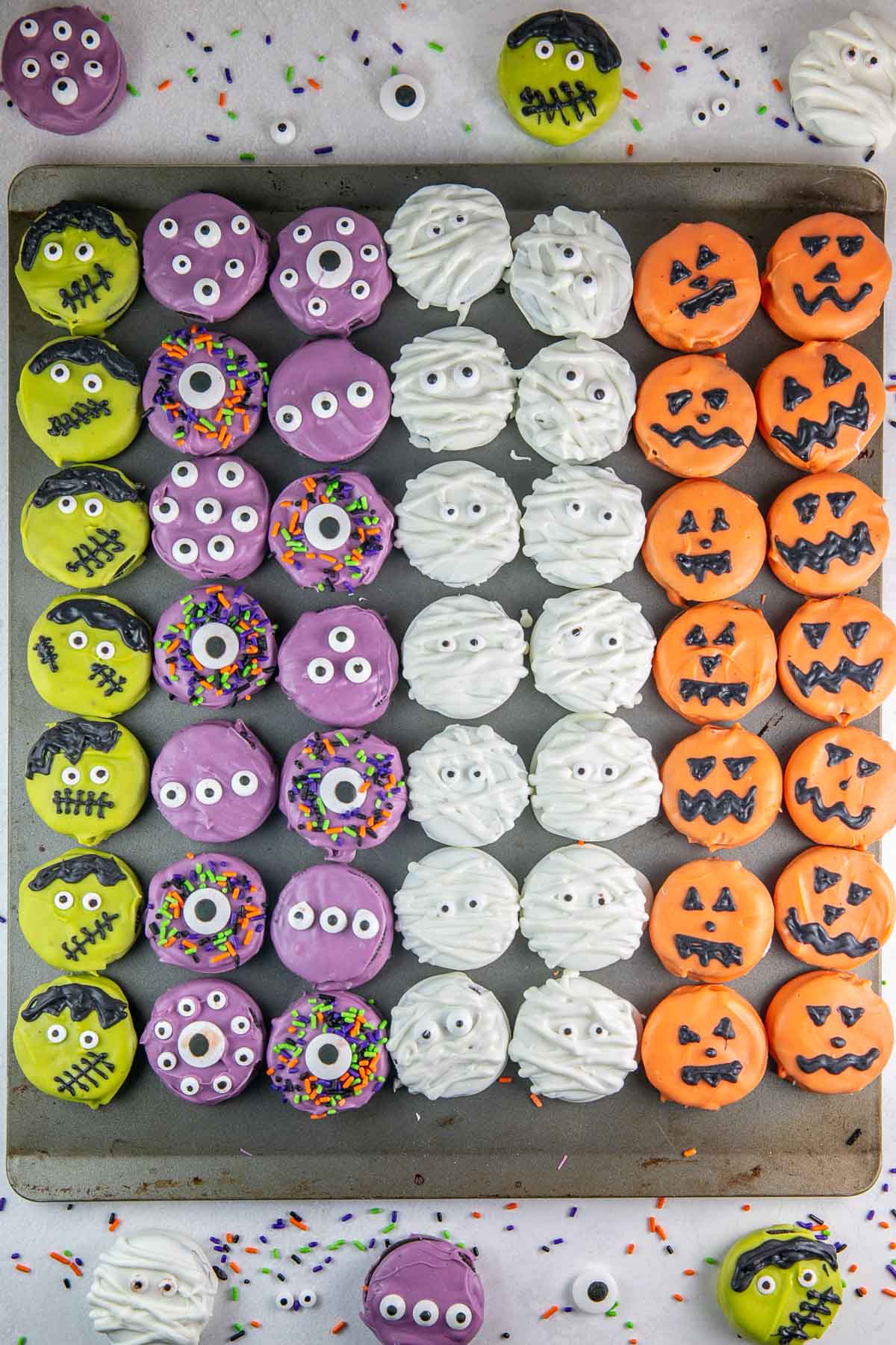 chocolate covered oreos decorated as monsters, mummies, pumpkins, and frankensteins.