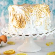 lemon cake with lemon curd filling covered in toasted meringue