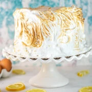 lemon cake with lemon curd filling covered in toasted meringue