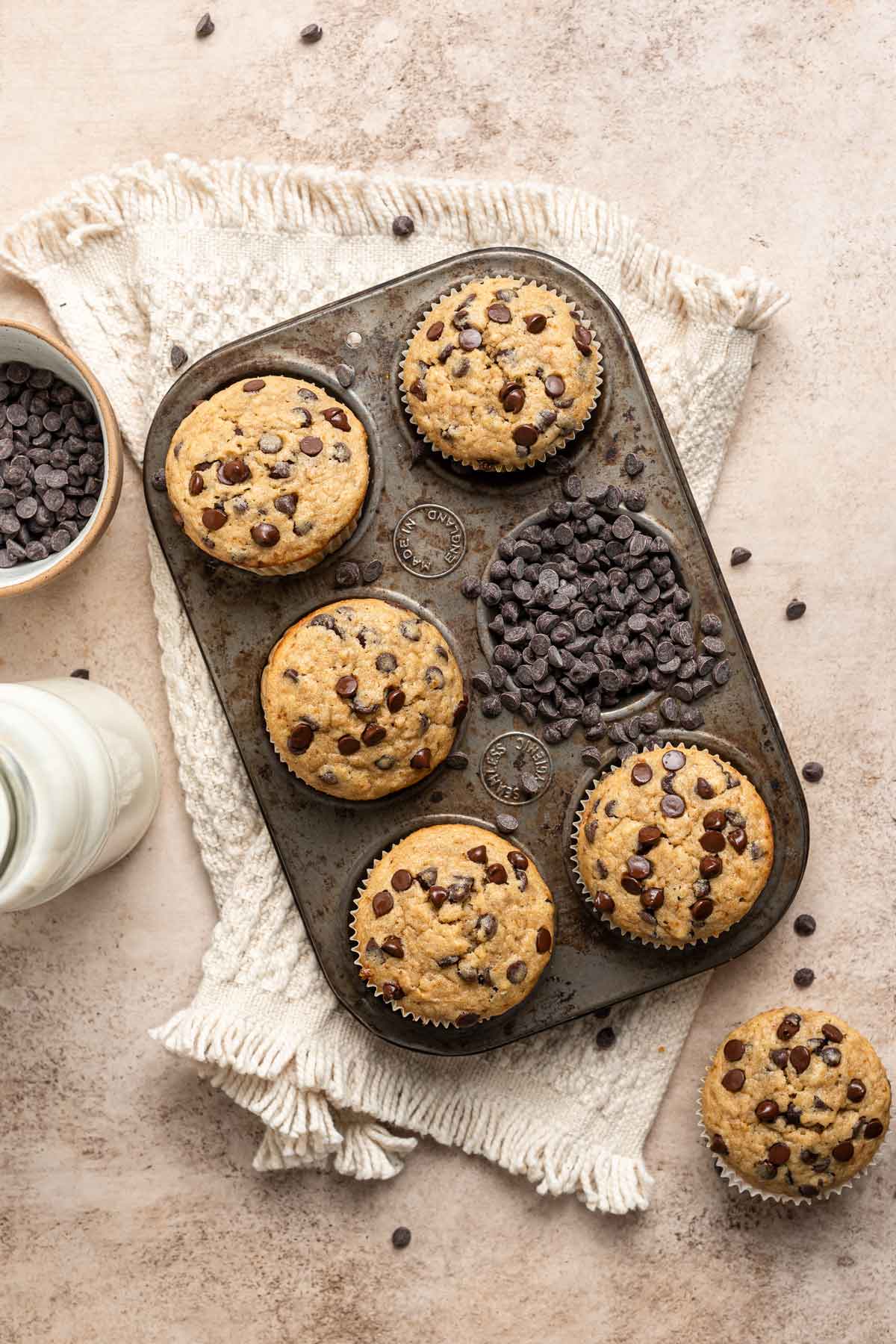 freshly baked banana bread muffins in a muffin tin.