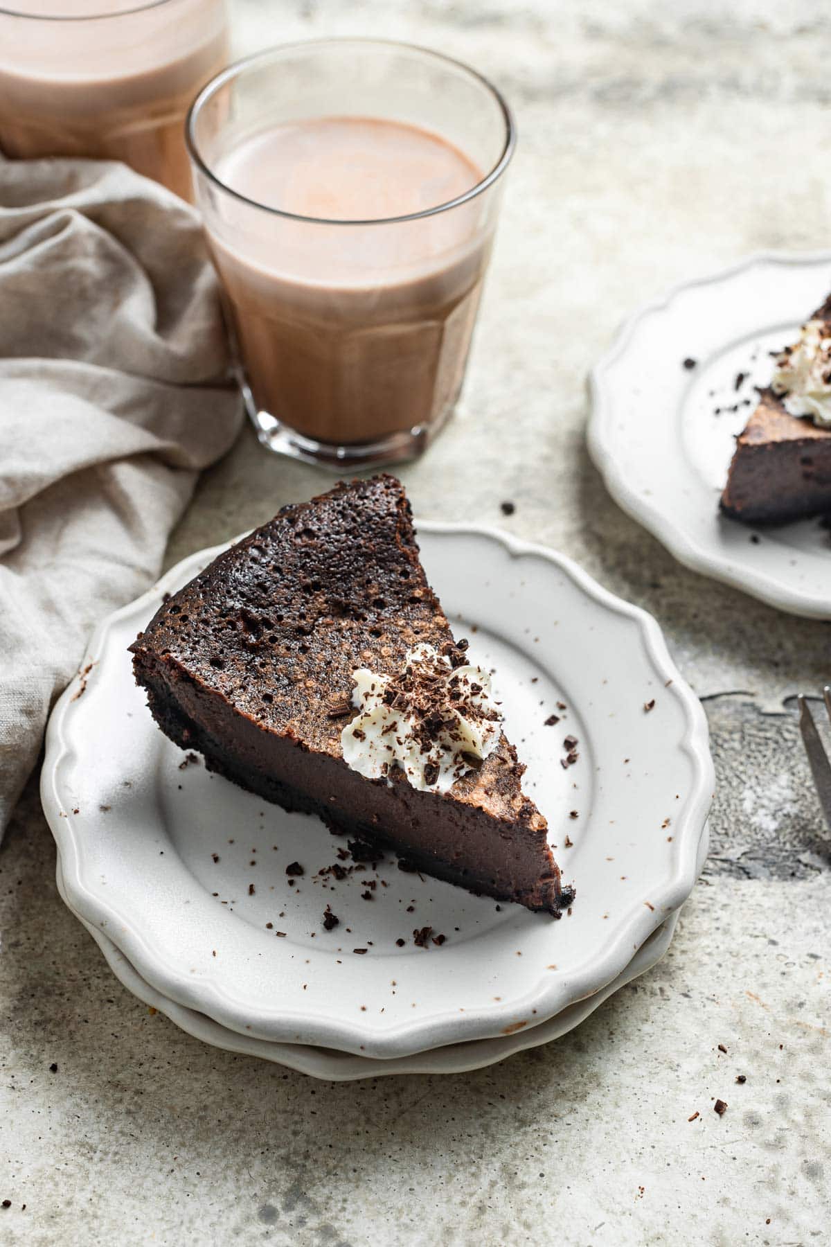 side view of a slice of pie showing off the thick, chocolatey custard interior