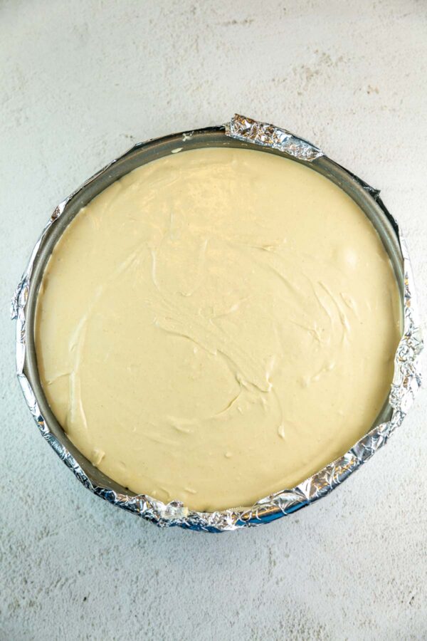 cheesecake batter in a springform pan before baking